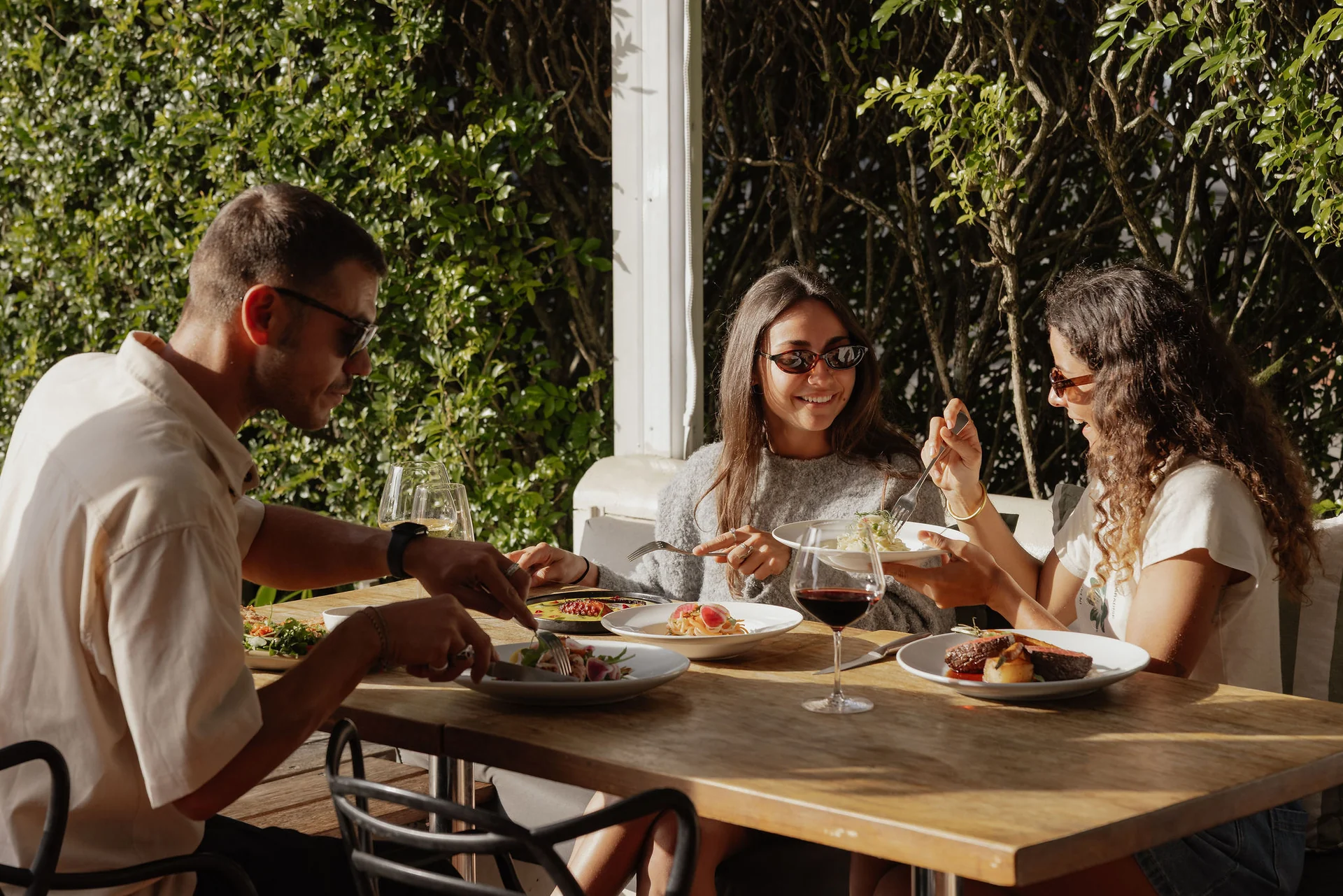 Friends dining together at Trattoria Byron Bay